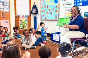 teacher doing read aloud with pre-k classroom