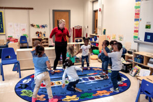 teacher leading activity with pre-k students